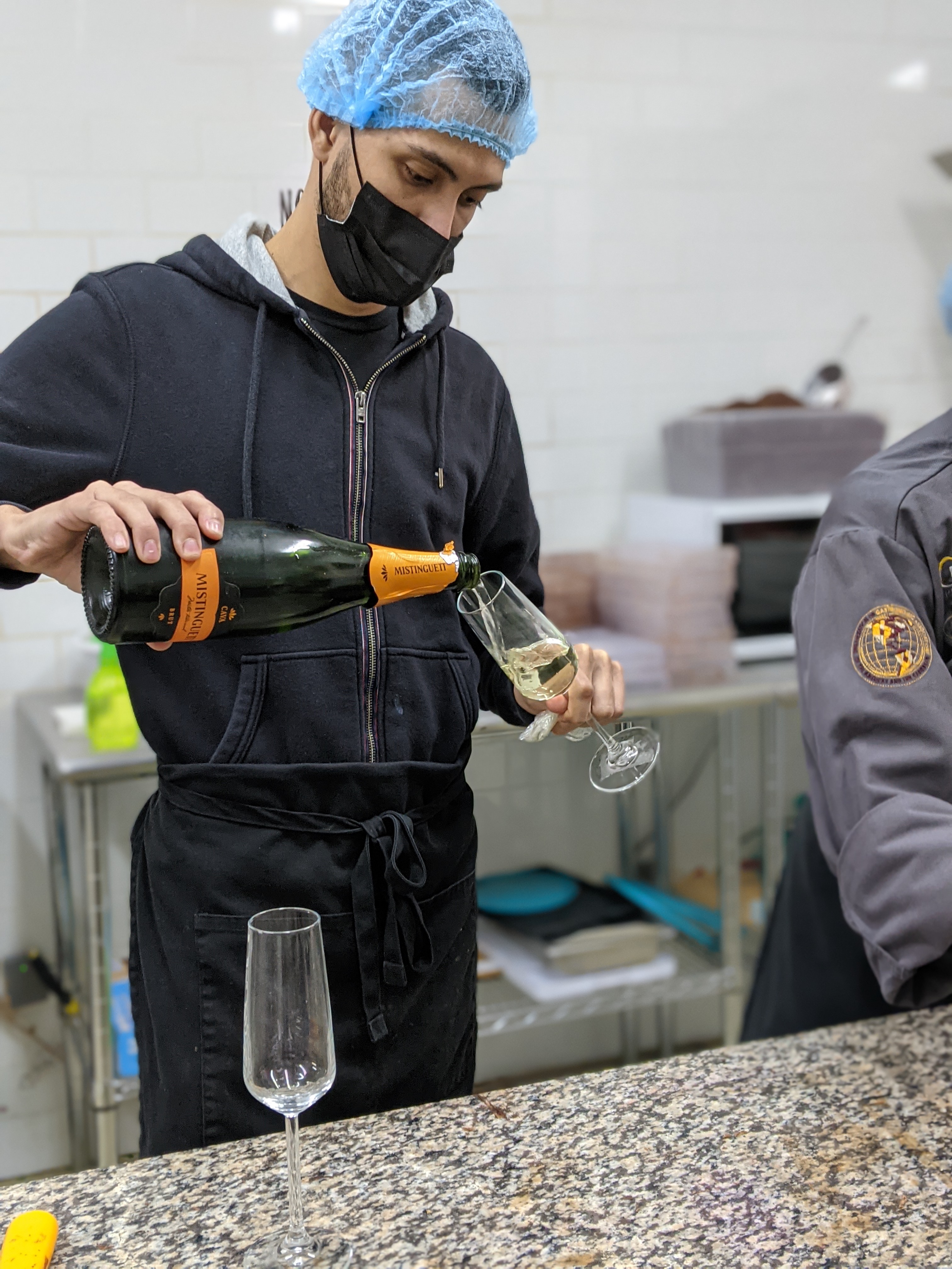 Champagne toast at Nomé Chocolate Panamá