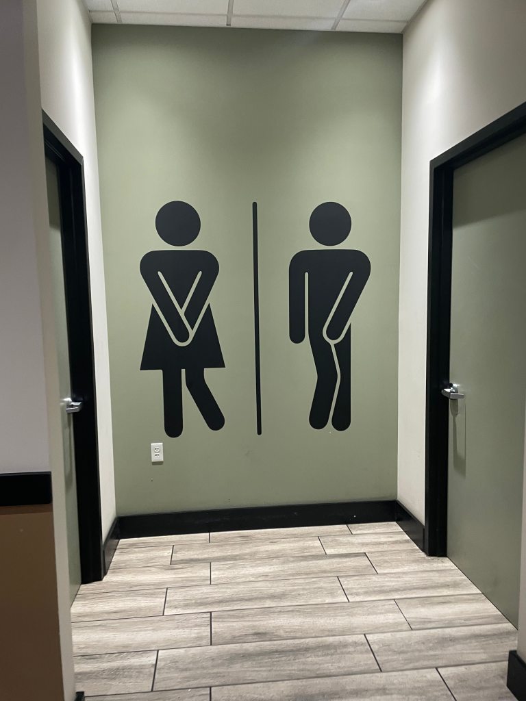 Bathroom sign at Green Eggs Cafe in Philly