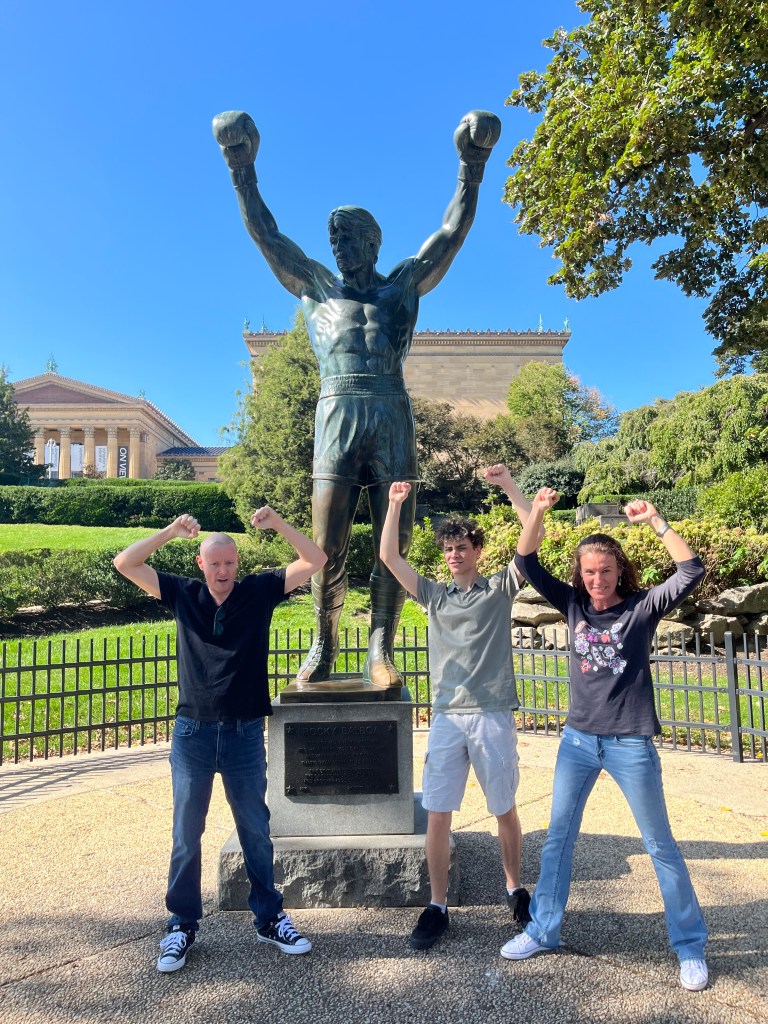 Posing with the Rocky statue in Philly