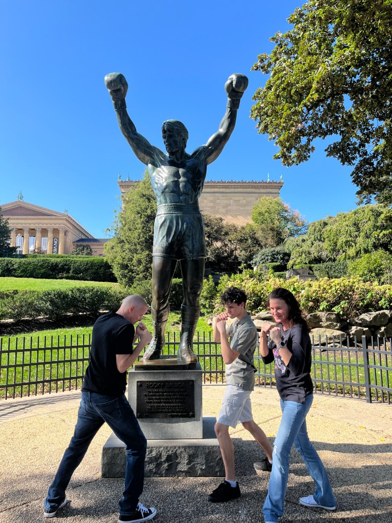 Posing with the Rocky statue in Philly