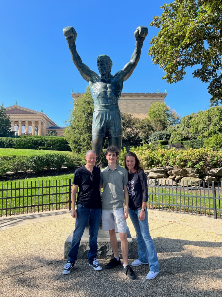 Posing with the Rocky statue in Philly