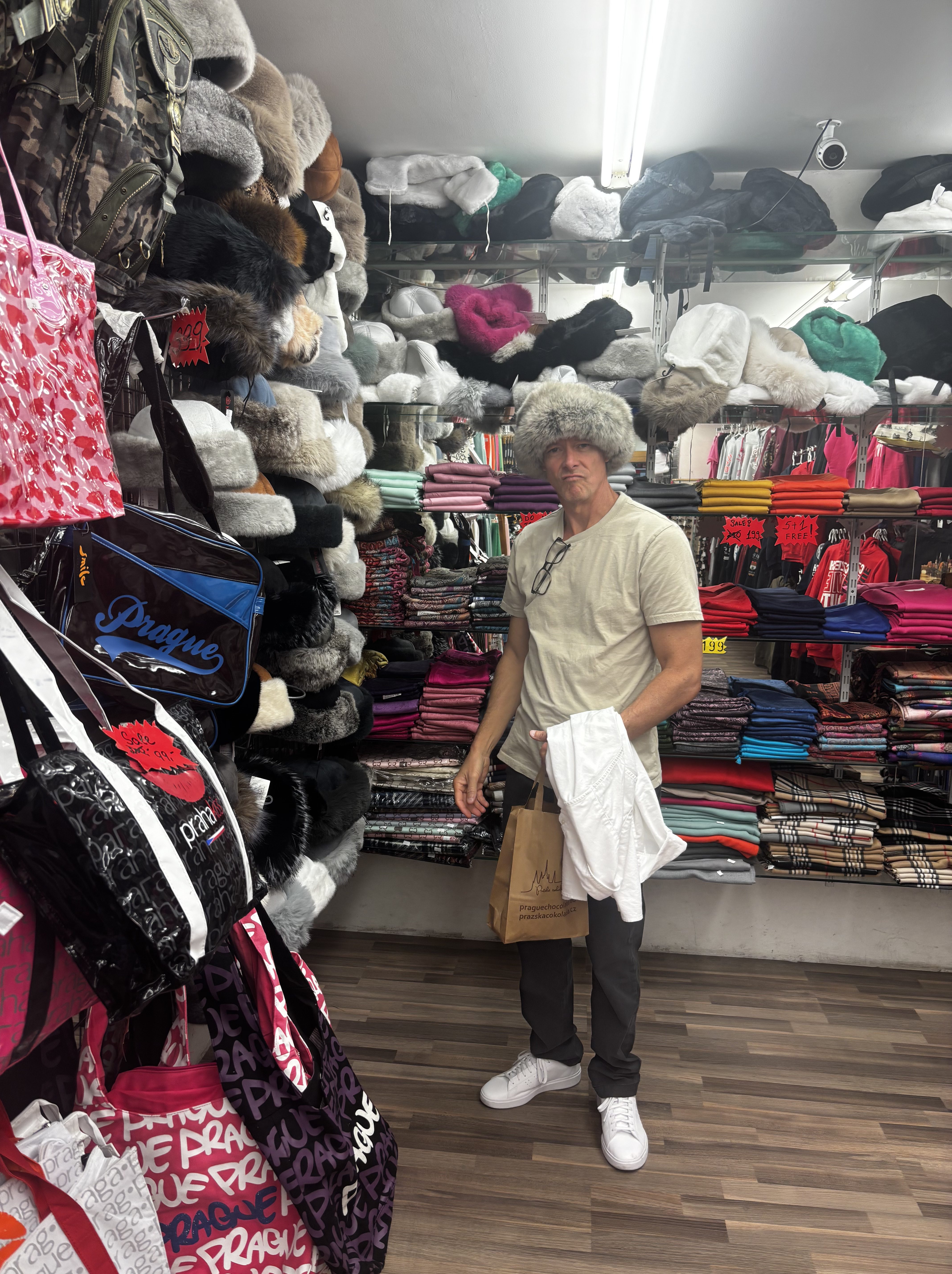 trying on hats in Prague